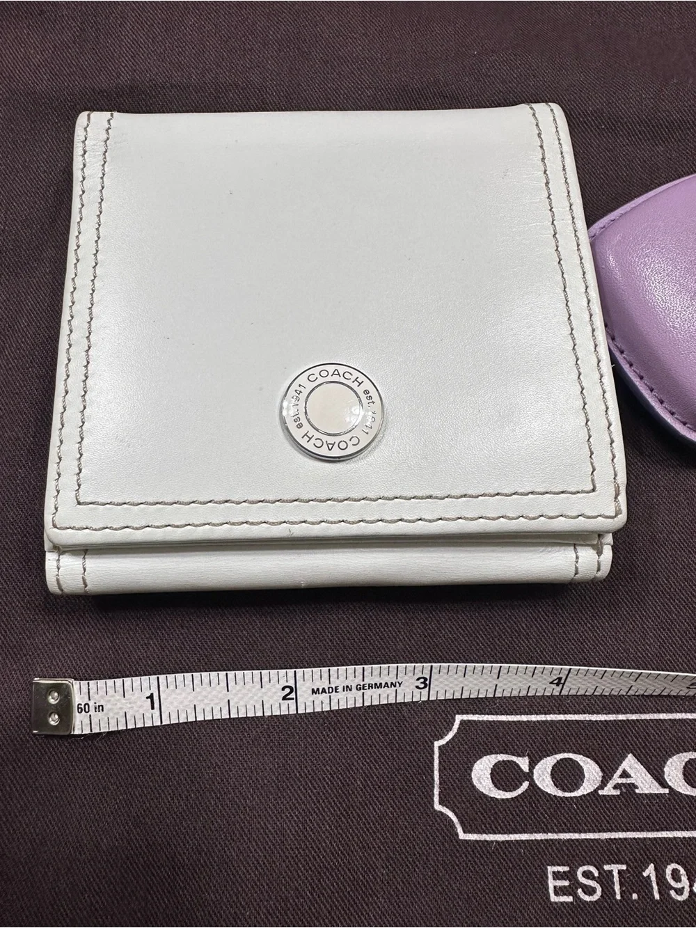 COACH White Leather Fold Wallet with Signature Metal Accent